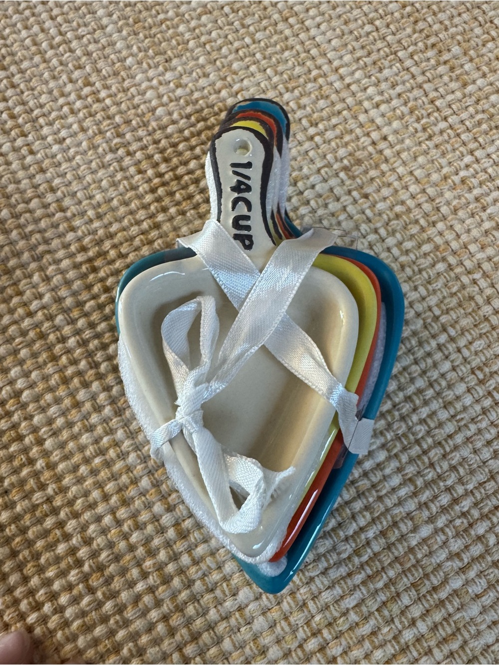 stacked set of multicolor ceramic triangle measuring cups